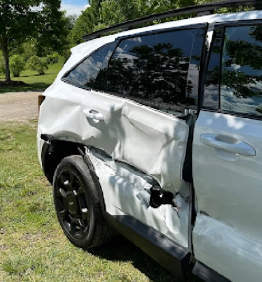Severely damaged white car