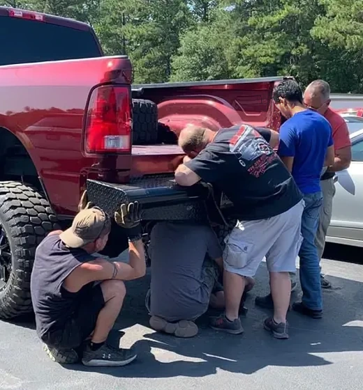 Team repairing truck bumper