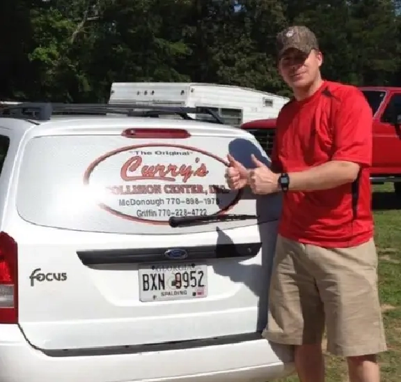 Technician working under car