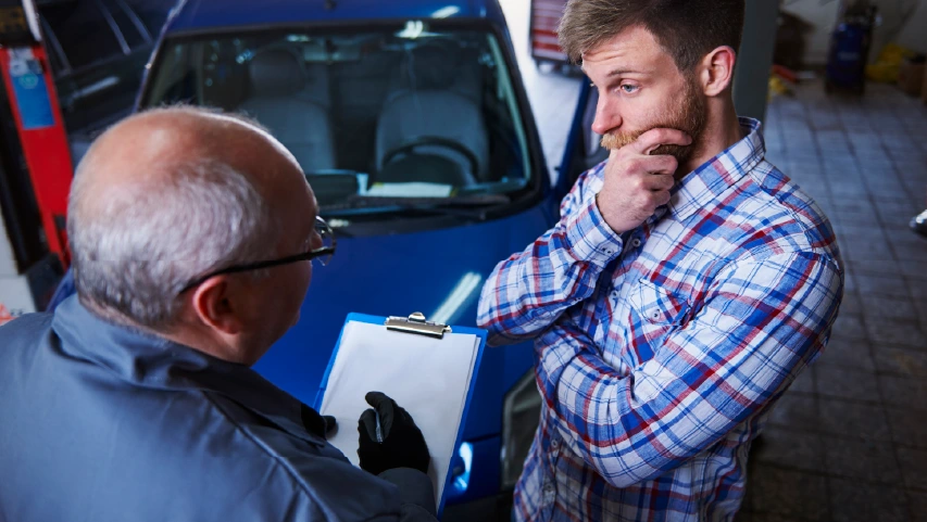 Customer talking to mechanic