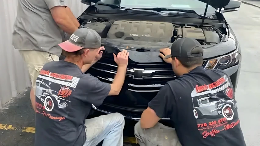 Curry's Collision team repairing car