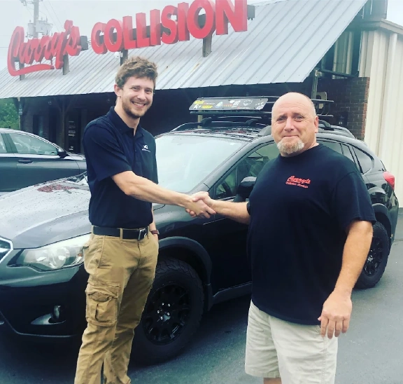 Men shaking hands outside