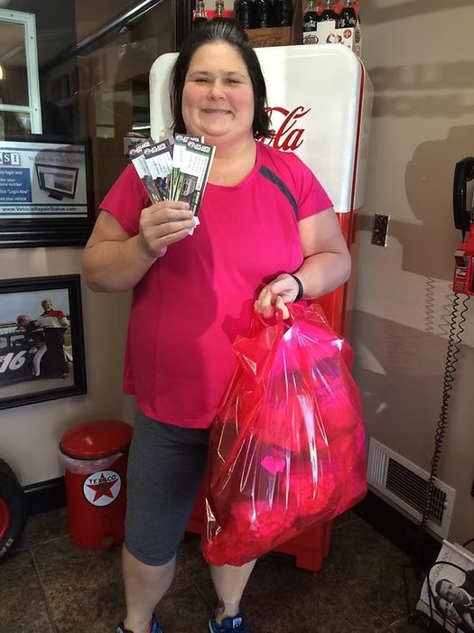 Winner holding prize bag